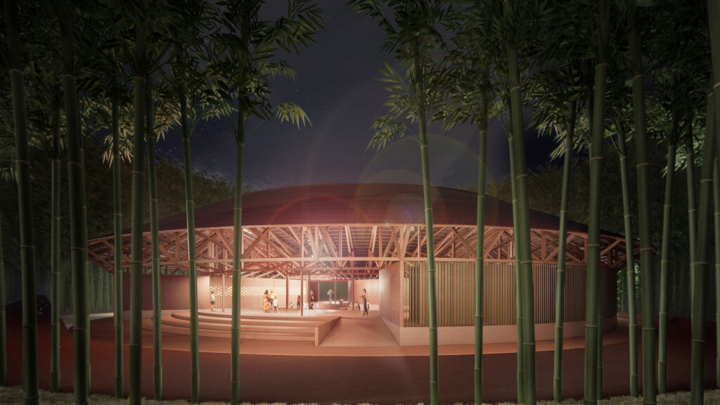Architekturvisualisierung des Kulturzentrums hinter Bambuspflanzen bei Nacht.