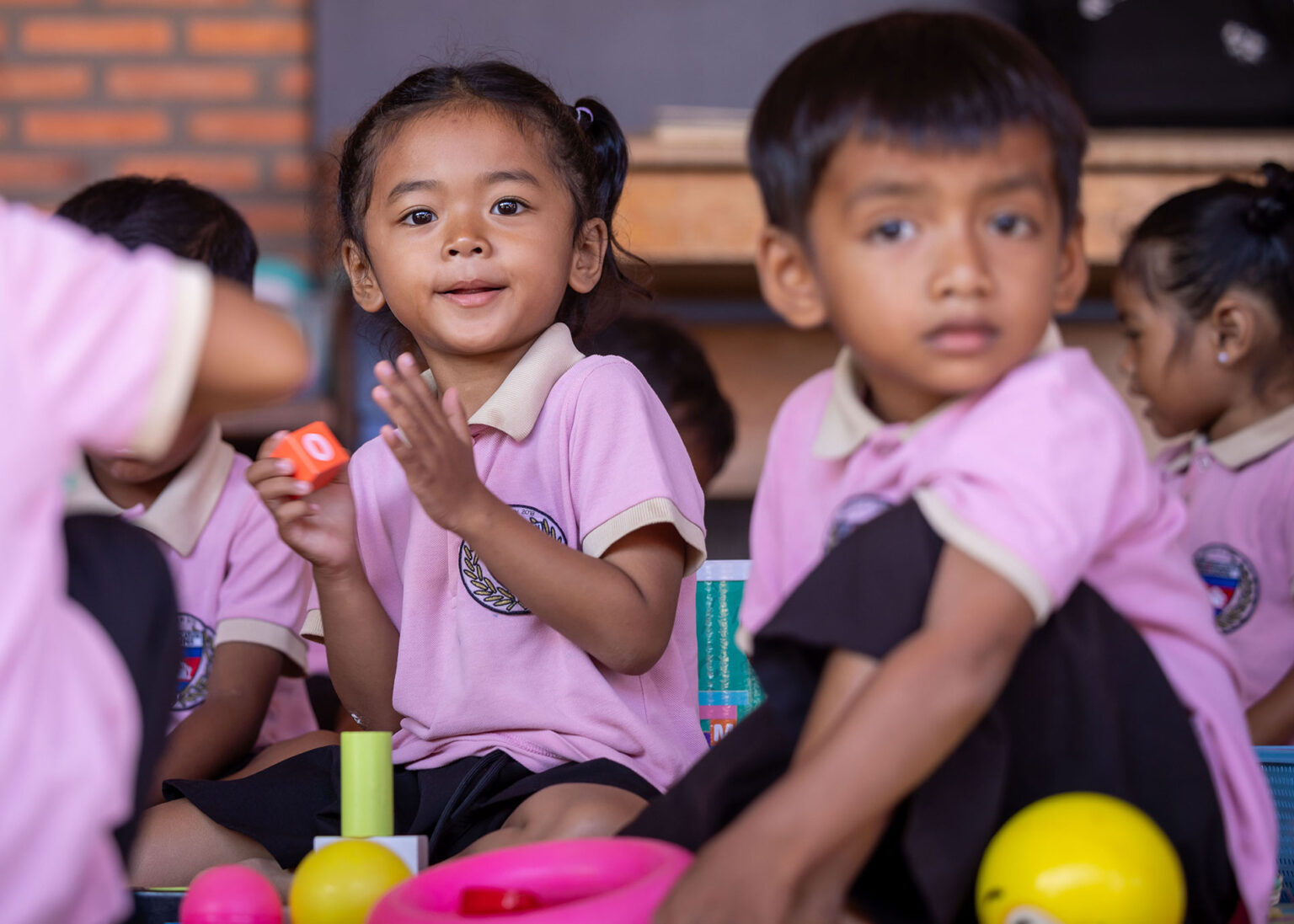 Children playing with colourful toys at kindergarten.